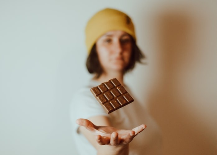 Woman with chocolate on her hand