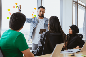 work-culture-man-talking-to-a-group-of-people-16-9